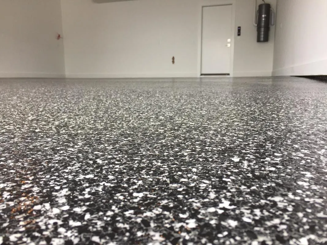 A Raven-blend flake floor installed by LB Epoxy Flooring